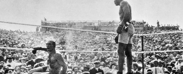GREAT WHITE HOPE DOWN: After a third knockout in the 15th round the referee and promoter protected James J. Jeffries while from his corner the pious towel was thrown into the ring with Arthur John Johnson, known as Jack Johnson standing