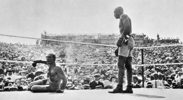 GREAT WHITE HOPE DOWN: After a third knockout in the 15th round the referee and promoter protected James J. Jeffries while from his corner the pious towel was thrown into the ring with Arthur John Johnson, known as Jack Johnson standing