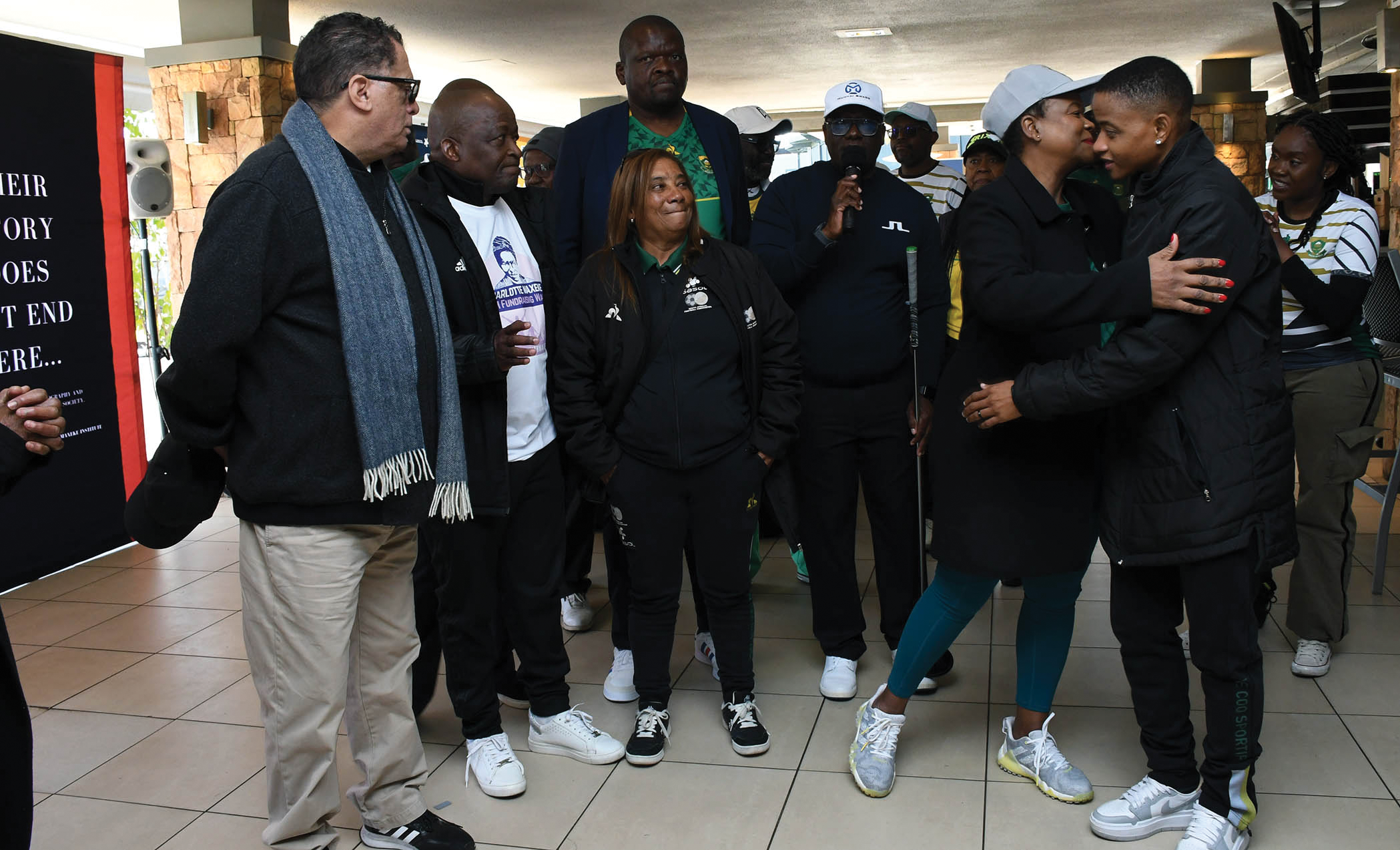 Coach Desiree Elis flanked by far left Danny Jordan, Gwen Ramokgopa and captain