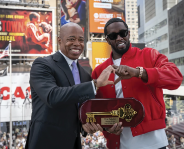 ICON: New York mayor Eric Adams, presenting the Key to the City of New York to hip-hop artist Sean “Diddy” Combs at the city’s Times Square today. PHOTO: Office of the New York Mayor/Caroline Rubinstein-Willis