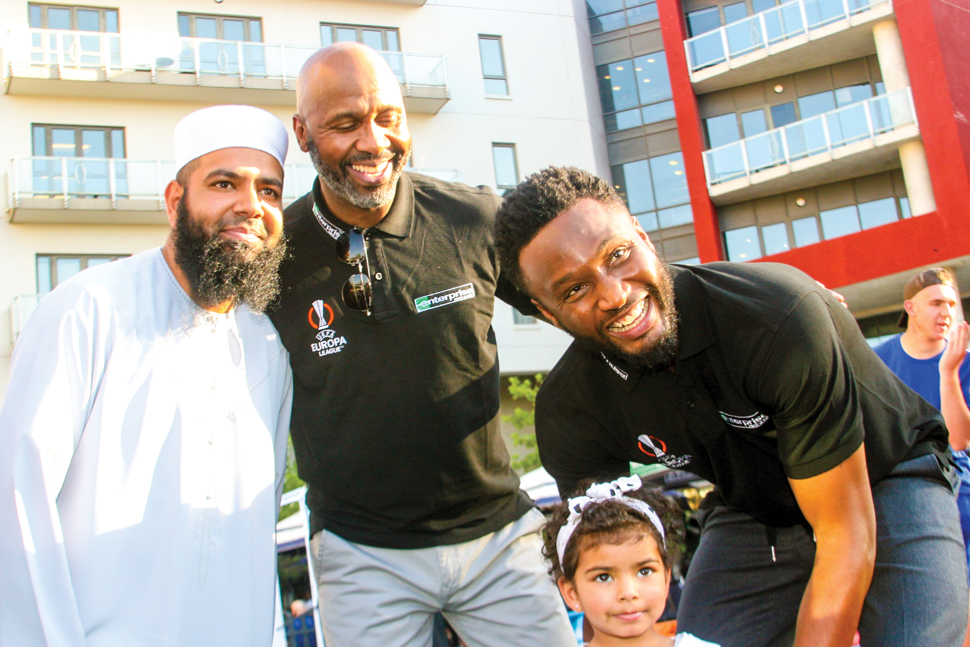 Lucas Radebe and John Obi Mikel, Enterprise Rent-A-Car representatives, posed with fans during the UEFA Europa League Trophy Showcase in Melrose Arch.
