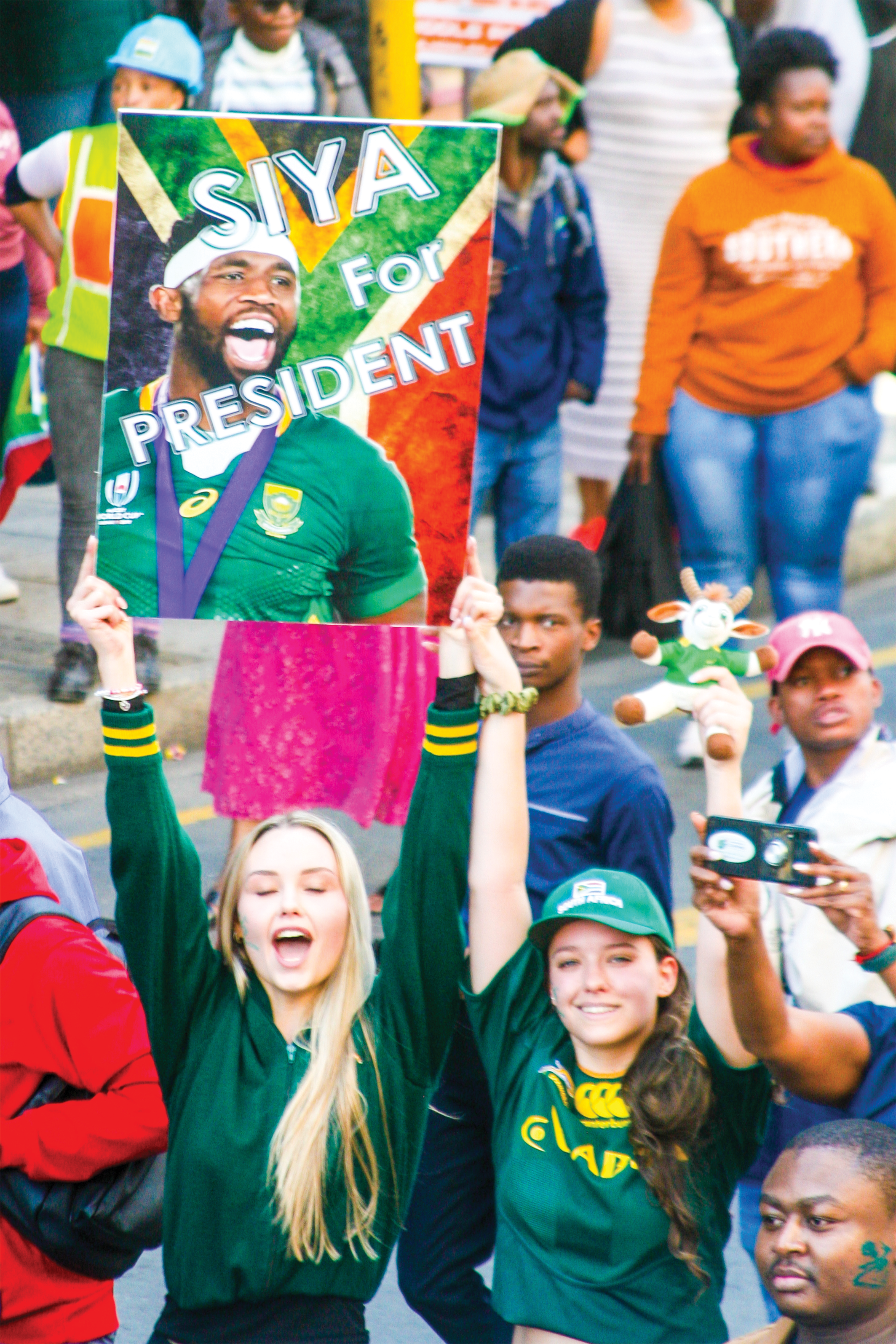 Springboks’ fans in Braamfontein brandish a Siya for President poster during the procession of the Joburg leg of the Trophy Tour