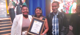 Glitz.. Ace Ntsoelengoe’s daughters Boipelo and Ofentse (holding the award) and brother Ernest at the ceremony