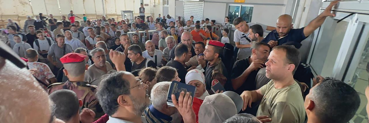 SCRAMBLE: The Rafah border crossing between Gaza and Egypt on November 1 2023. The only way out of Gaza sinceIsrael launched its brutal assault on the coastal strip in October is through the Rafah border with Egypt. But Egyptian security forces tightly control who gets to cross. It often depends on who has the money to pay. And the price tag has skyrock- eted as desperation in the enclave. (Photo: Yasser Qdeih)