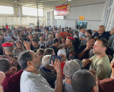 SCRAMBLE: The Rafah border crossing between Gaza and Egypt on November 1 2023. The only way out of Gaza sinceIsrael launched its brutal assault on the coastal strip in October is through the Rafah border with Egypt. But Egyptian security forces tightly control who gets to cross. It often depends on who has the money to pay. And the price tag has skyrock- eted as desperation in the enclave. (Photo: Yasser Qdeih)