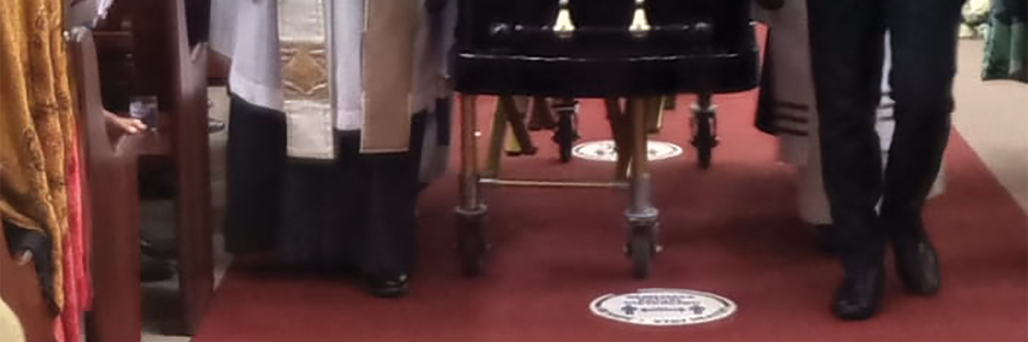 FAREWELL: A pastor at Christ the King church in Sophiatown, Johannesburg, leads a procession of pallbearers carrying Sedupe Ramakgopa’s coffin out of the parish to the cemetery yesterday.