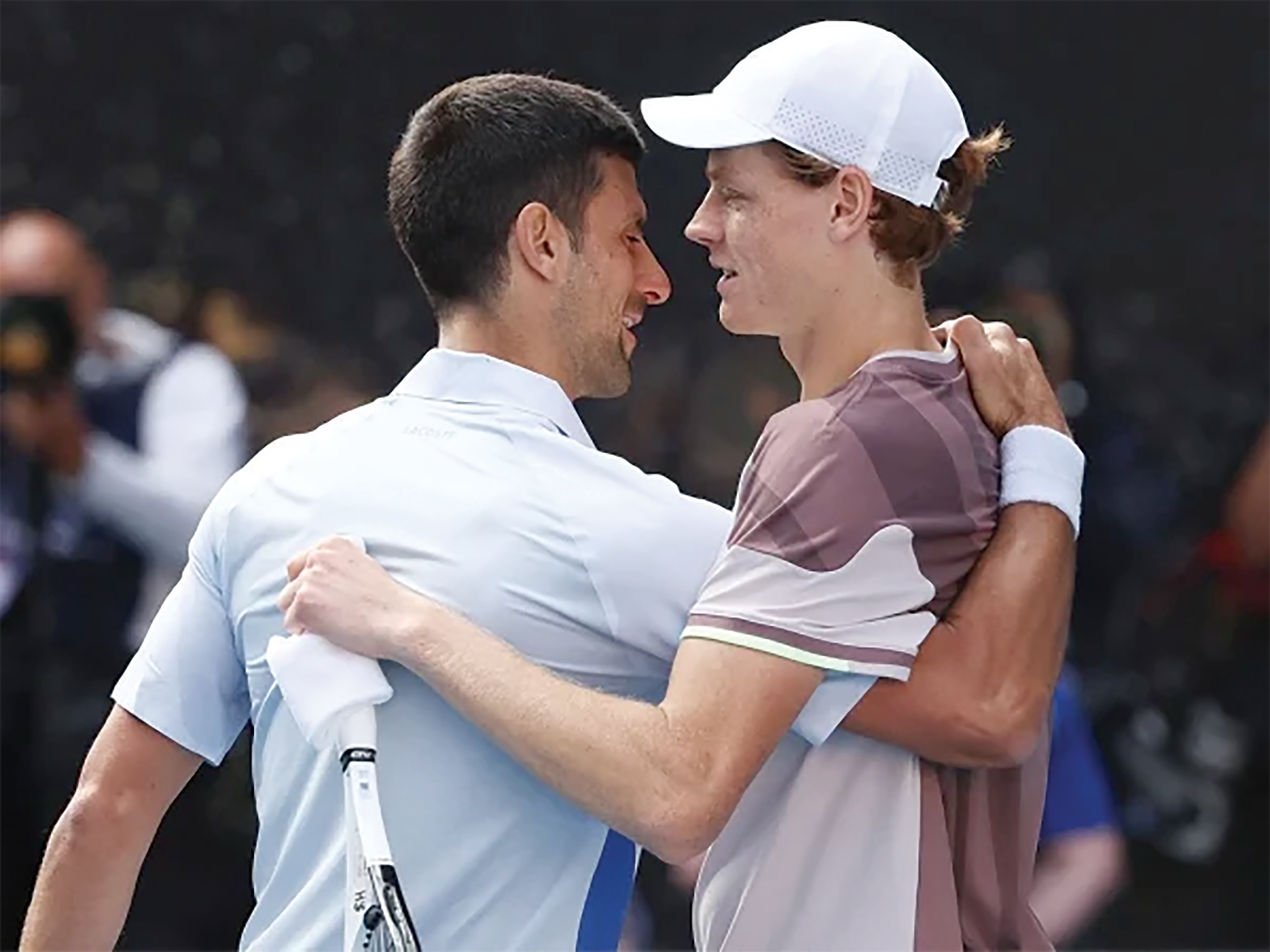 WELL DONE; Novak Djokovic giving Jannik Sinner a congratulatory hug after their semi-final match which the latter won to reach the final of the Australian Open scheduled for Sunday