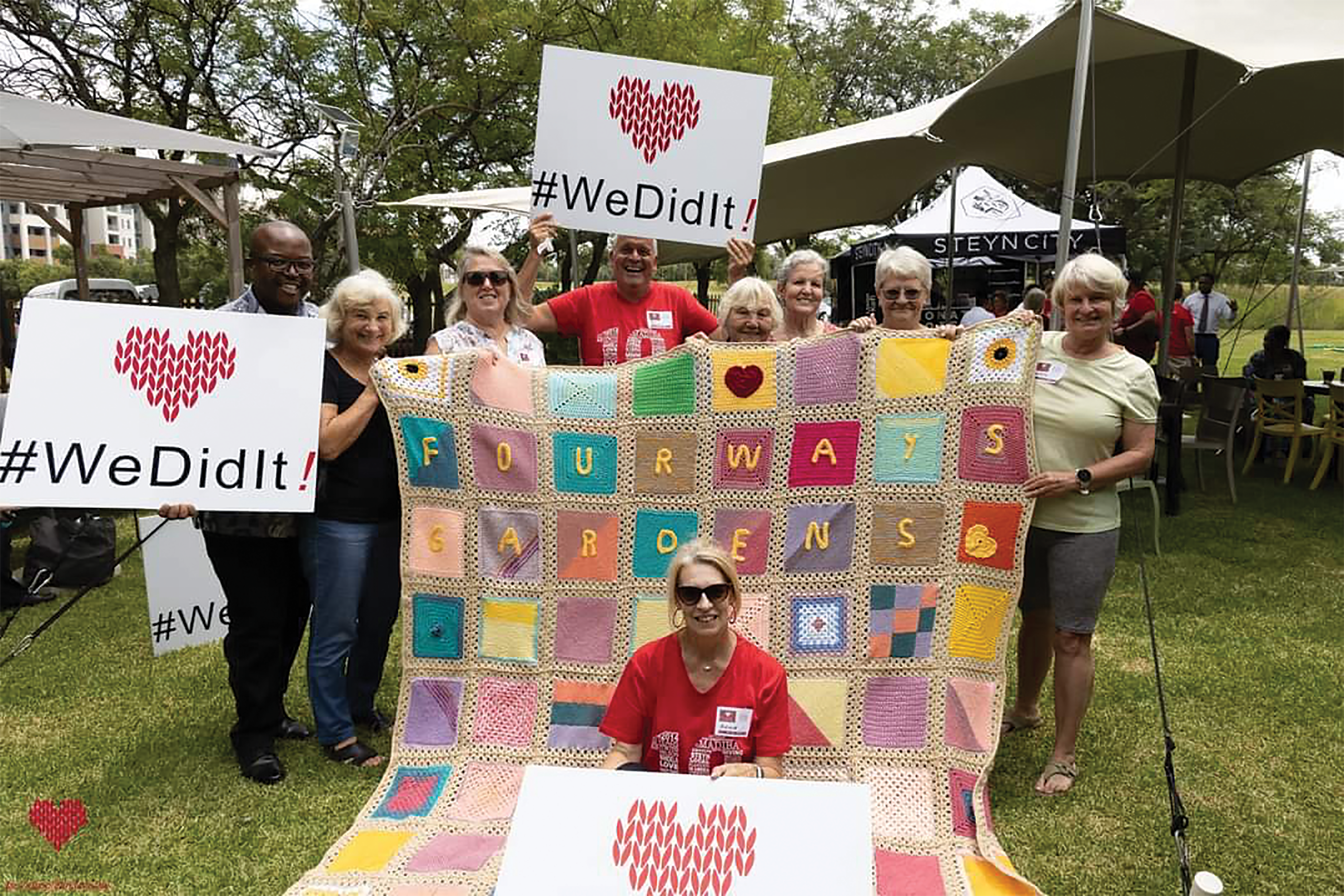 COMPASSION: KnitWits volunteers show off their work at the 67 Blankets for Nelson Mandela Day